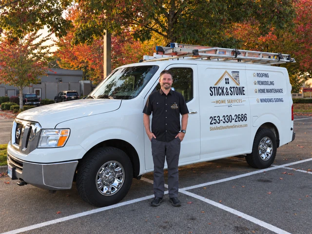 John Tibbs beside the Stick & Stone Home Services work van