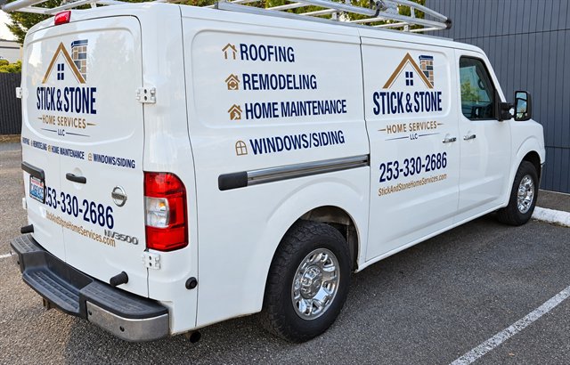 Stick & Stone work van with the company logo and services on the side and rear
