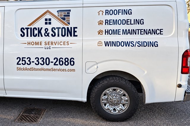 Stick & Stone work van showing the company logo, roofing and remodeling services, and business phone number